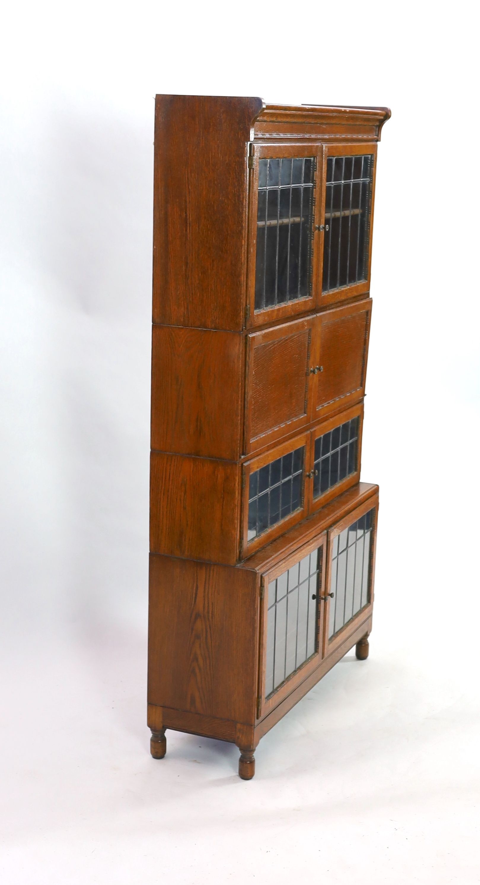 An early 20th century Globe Wernicke style four section bookcase, with leaded glazed doors, width 89cm depth 30cm height 162cm